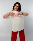 Knitwearен комплект с надпис NewYear25, cotton и elastane, изображение на моден брой с надпис за новогодишен празник.