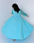 Long embroidered dress made from polyester, model SV082025, with detailed decorative embroidery and elegant design.
