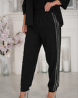 Ленен комплект pants с декоративни камъни и linenти, произведен от 80% linen и 20% polyester, върху модел.