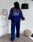 Set with a mesh bomber jacket made from polyester, viscose and spandex, shown on a model, suitable for stylish everyday wear.