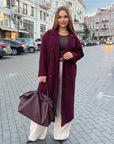 Long faux-cashmere coat with polyester, viscose and wool, model with long sleeves and classic design.