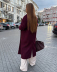 Long faux-cashmere coat, beige with cut, made from polyester, viscose and wool, stylish and warm model.