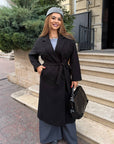 Long faux-cashmere coat with polyester, viscose and wool, model with classic cuts and elegant design.
