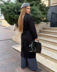 Long faux cashmere coat in a blend of polyester, viscose and wool, with an elegant design and cosy texture.