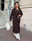 Long faux cashmere coat in a blend of polyester, viscose and wool, model with simple design and classic cut.