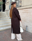 Long faux-cashmere coat with polyester, viscose and wool, shown on a model, in brown.