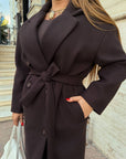 Long faux-cashmere coat with polyester, viscose and wool, model in a neutral colour, suitable for winter style.