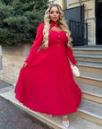 Elegant midi dress in viscose and polyester, with a clean design and elegant silhouette, suitable for formal occasions.