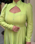 Elegant midi dress in viscose and polyester, with a tailored cut and details, suitable for stylish occasions.