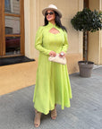 Elegant midi dress in viscose and polyester, shown on a model, with a clean design and cut-out details.