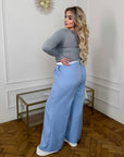 Draped blouse от polyester и spandex, показана на снимка, с дълги Sleeveи и елегантен дизайн.