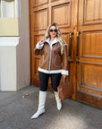 Short faux leather coat, 100% polyamide, with long sleeves and a classic cut, suitable for a winter style.
