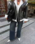 Short faux leather coat, waist-length, white, tailored with details, suitable for a stylish winter outfit.