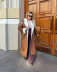 Long faux leather coat, 100% polyamide, with long sleeves and a classic design, suitable for autumn and winter.