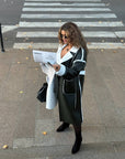 Long women's faux leather coat, 100% polyamide, with a fashionable design and classic cut, ideal for a stylish winter outfit.