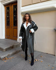 Long faux leather coat, 100% polyamide, stylish design and modern look, suitable for the winter season.