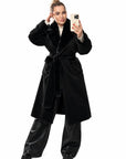 Long mixed-fabric coat in polyester and spandex, black, with a modern cut and long sleeves.