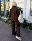 Fleece set with wide-leg trousers in polyester and elastane, shown in the image.