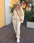 Velour hooded set in polyester and spandex, a stylish and comfortable women's outfit.