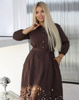 Flared dress with cut-outs and stones, polyester, viscose and spandex, in an elegant design.