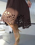 Flared dress with cut-outs and stones, in polyester, viscose and spandex, an elegantly designed style with details.