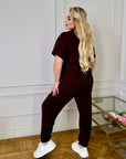 Knitwearен комплект със 63% cotton, 4% elastane и 33% polyester, показан на изображението.
