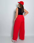 Стиlinen дамски pants с декорации и копчета, направен от polyester, viscose и spandex, с моден дизайн.