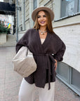 Cropped cardigan with a belt made from polyester and viscose, shown in the photo, in modern style and elegant design.