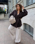 Cropped cardigan with a belt made from polyester and viscose, model with a stylish design and cut, suitable for everyday style.