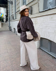 Cropped cardigan with a belt made from polyester and viscose, model with elegant design, suitable for everyday style.