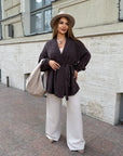 Cropped cardigan with a belt made from polyester and viscose, light colour, suitable for everyday style, image of a model.