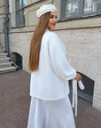 Cropped cardigan with a belt made from polyester and viscose, model with elegant design and modern cut, in the image.