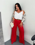 Women's wide-leg trousers made from polyester, viscose and spandex, white, model with comfortable cut.