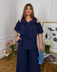 Комплект от памучна Fabric с волан, 70% cotton и 30% polyester, изображение на дреха с деликатен дизайн.