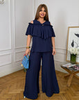 Комплект от памучна Fabric с волан, съдържа 70% cotton и 30% polyester, изображение на дреха с деликатен дизайн.