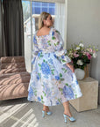 Миди рокля от organza с цветен принт, изработена от 100% polyester, с фееричен и елегантен дизайн.