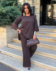 Loose-fitting set with rhinestones, made from polyester, viscose and lycra, shown on a model, light colour and elegant design
