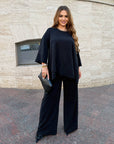 Loose-fitting set with rhinestones, composition: polyester, viscose and lycra, shown in an image.