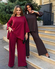 Loose-fitting set with rhinestones, made from polyester, viscose and lycra, shown in the image.