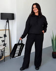 Soft ribbed-knit set with polyester, viscose and elastane, shown on a model, in gentle colours.