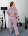 Soft ribbed knitted set with polyester, viscose and elastane, shown in the image.
