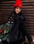 Short combined-fabric coat in polyester and spandex, waist-length, in a modern style.