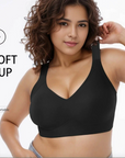 Woman wearing a black sports bra with text 'SOFT CUP' on a white background
