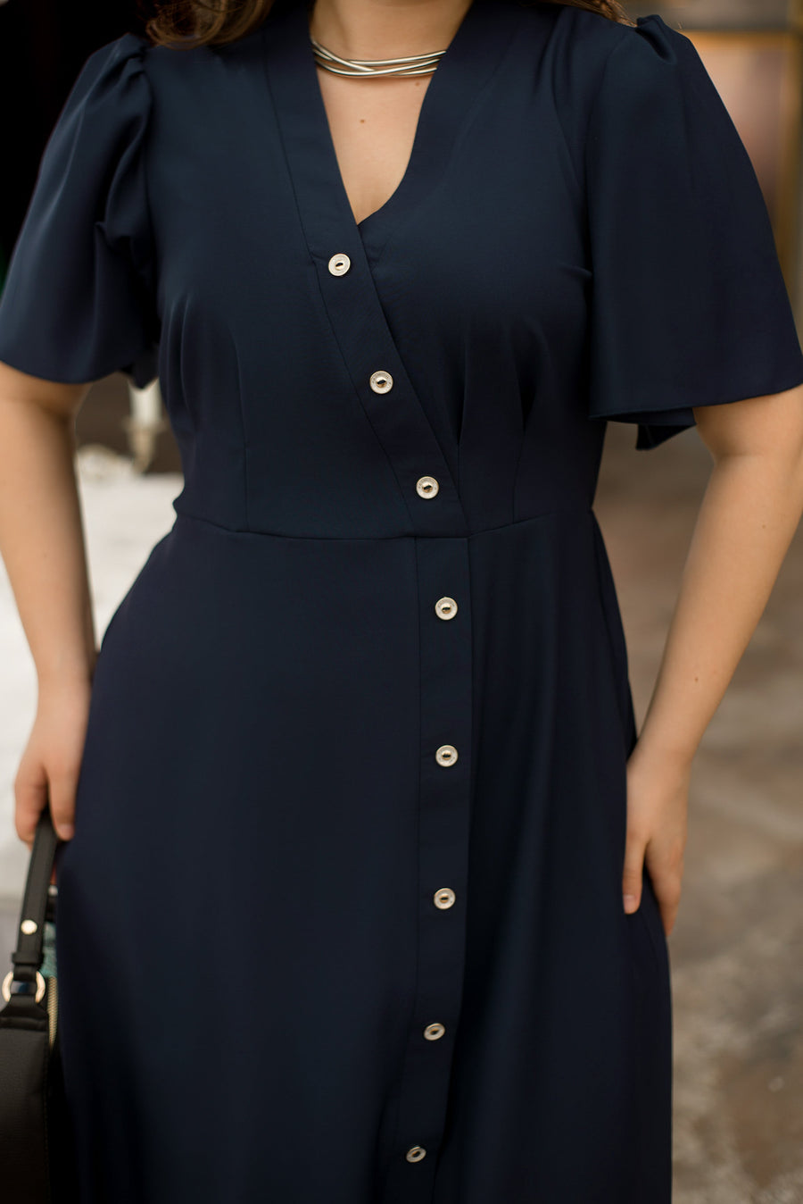 Asymmetrical dress with buttons