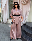 Satin set with a belt, with sparkling design, made from polyester and elastane, suitable for elegant and comfortable style.