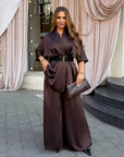 Satin set with a belt in delicate design, 97% polyester and 3% elastane, image of elegant set for home or bedroom.