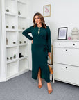 Midi dress with a slit made from polyester and viscose, shown on a model, suitable for stylish everyday events.