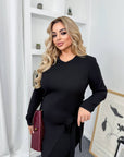 Stylish midi dress with a slit made from polyester, viscose and lycra, with an elegant design and slit, suitable for summer events.