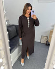 Stylish midi dress with a slit made from polyester and viscose, shown on a model, with an elegant design and modern look.