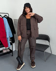 Windbreaker-fabric set made from polyester, image of blouse and trousers in a light colour, suitable for everyday use.